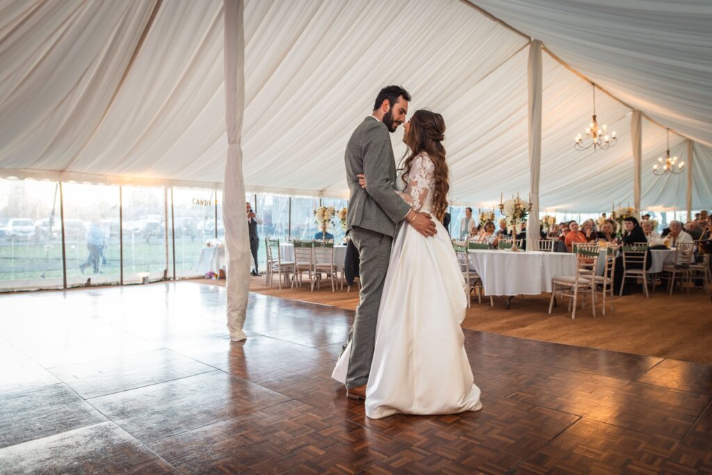 Couple sharing their first dance at an East Anglia wedding reception, lit by Tinsel Tim