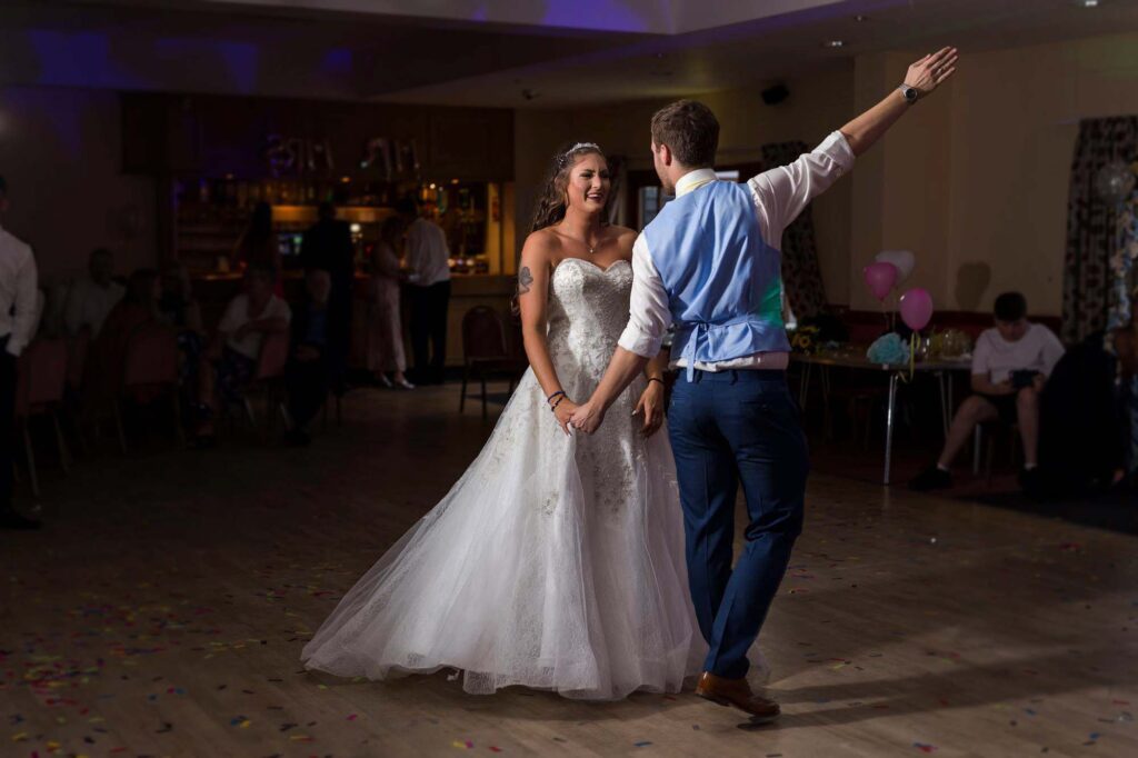 Bride and groom dancing their first dance at a Suffolk wedding reception
