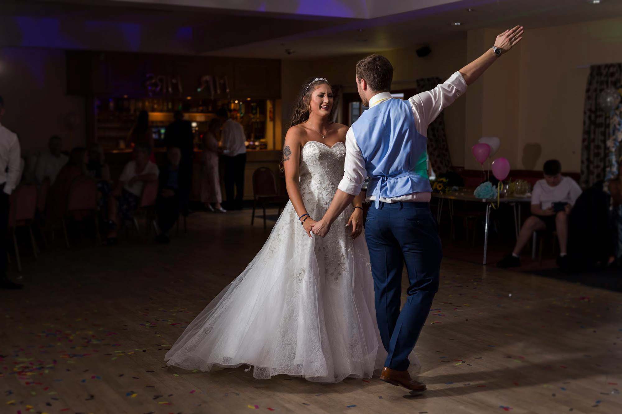 Bride and groom dancing their first dance at a Suffolk wedding reception